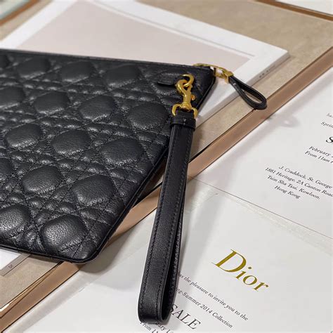 large dior caro daily pouch.